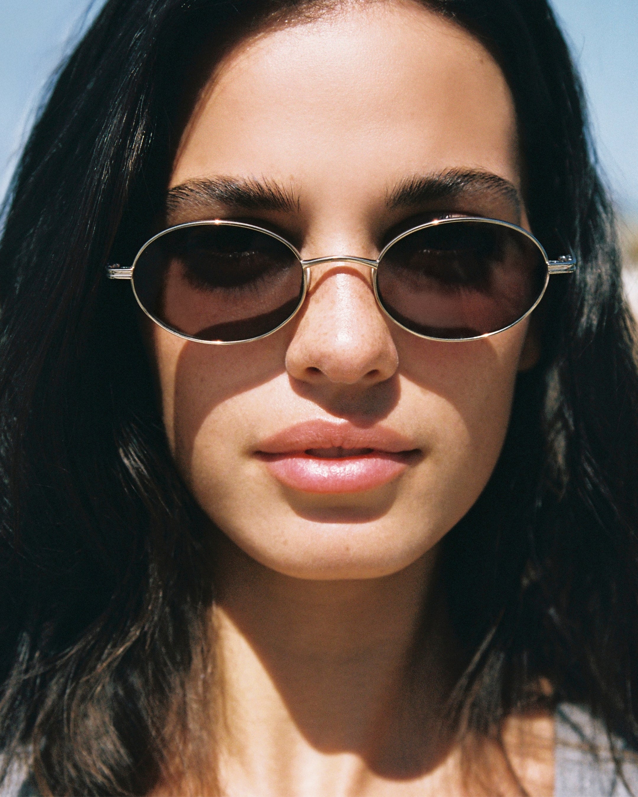 The Elvie Oval Women's Sunglasses in Gold