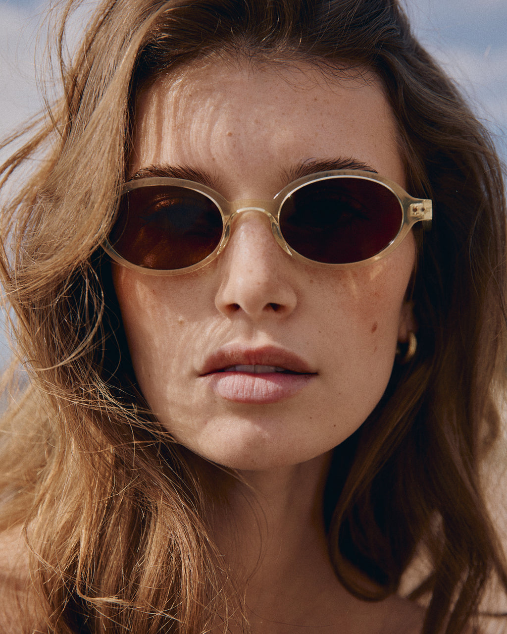 The Elvie Oval Women's Sunglasses in Crystal yellow
